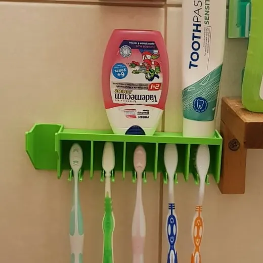 Wall toothbrush holder