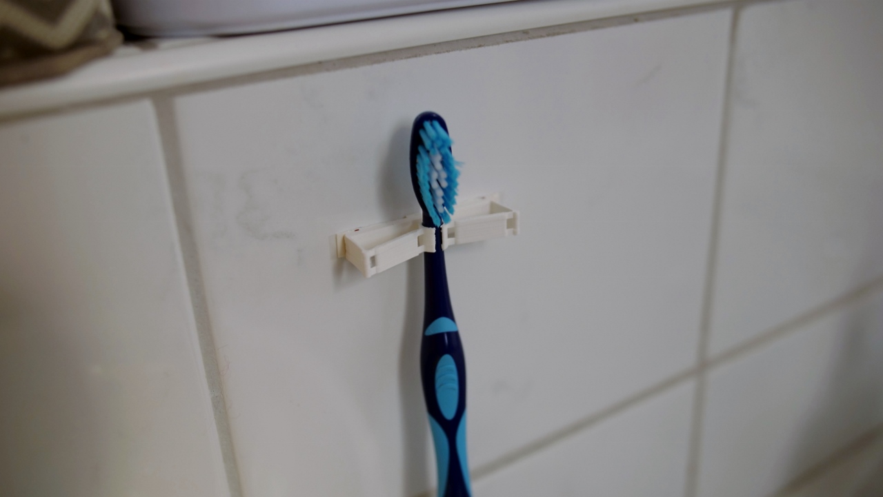 Compliant mechanism toothbrush holder - photo 4