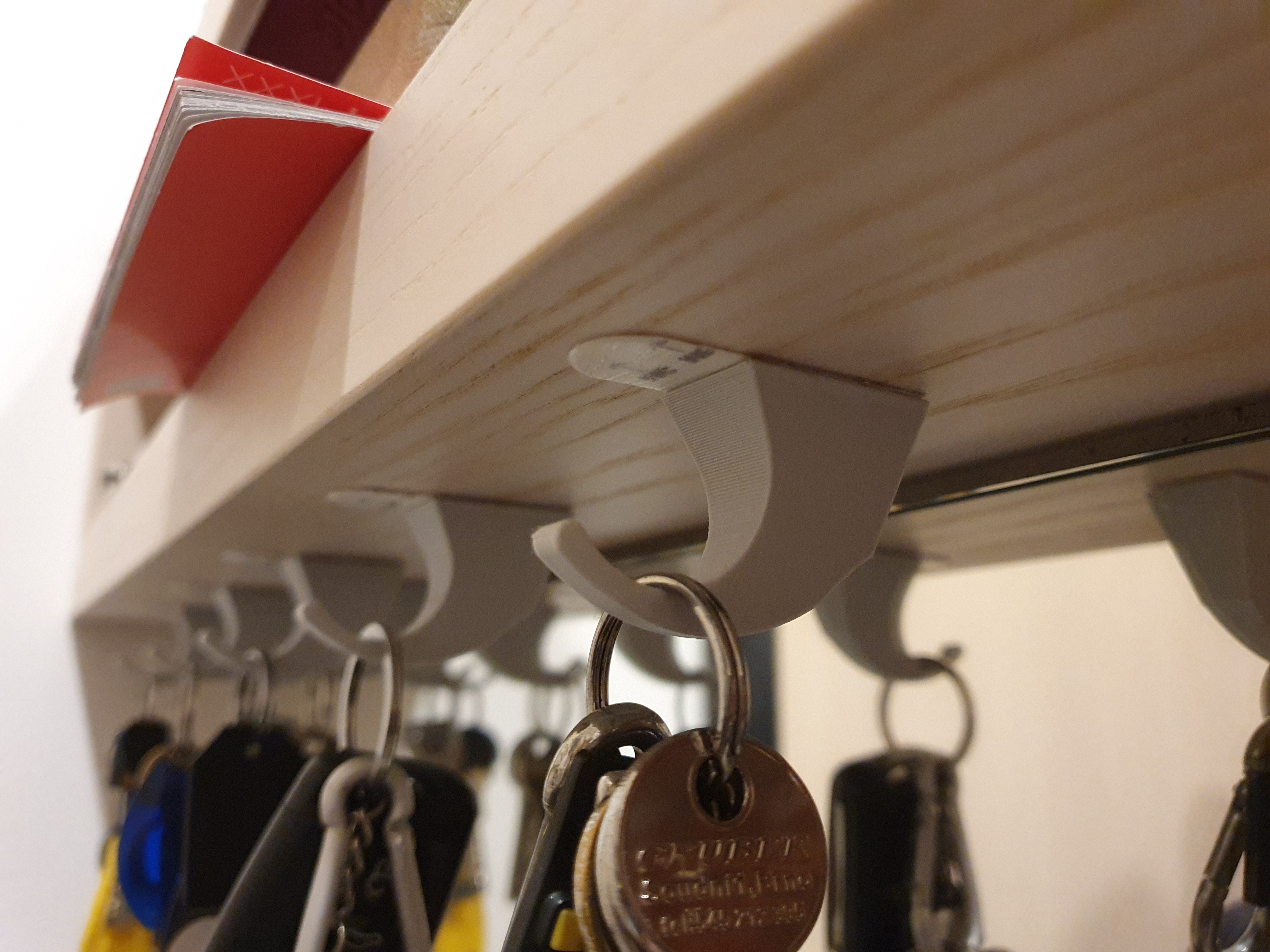 Keys hook under the shelf