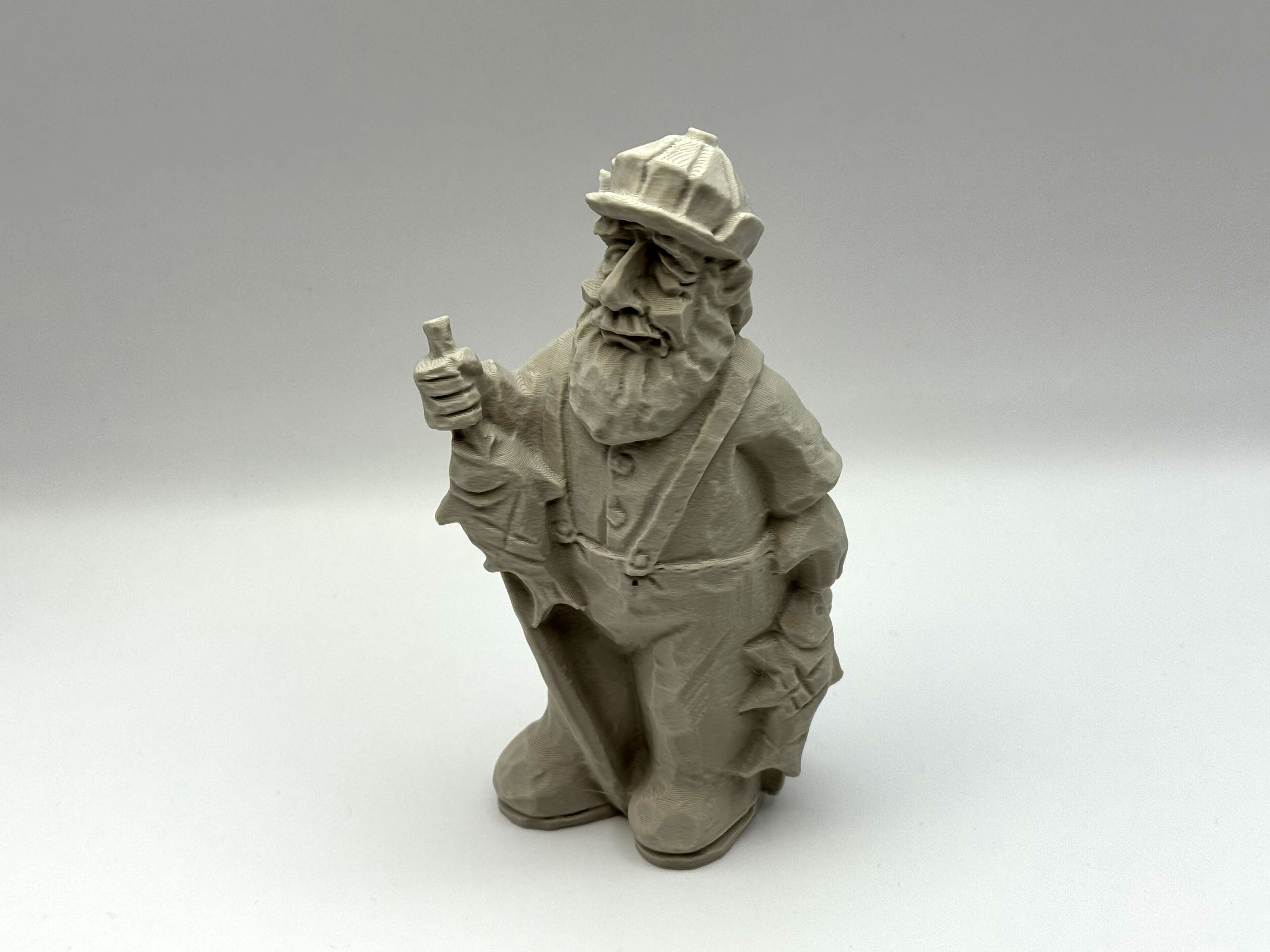 Carved Fisherman Figurine