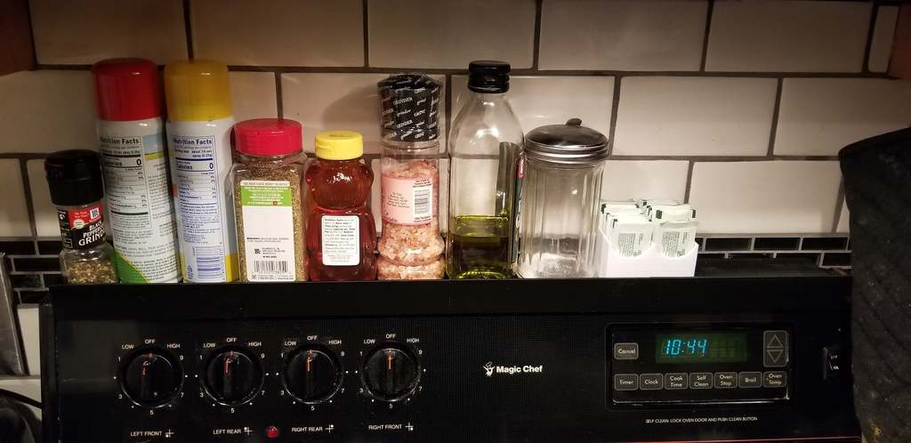 Stove mounted spice rack/shelf